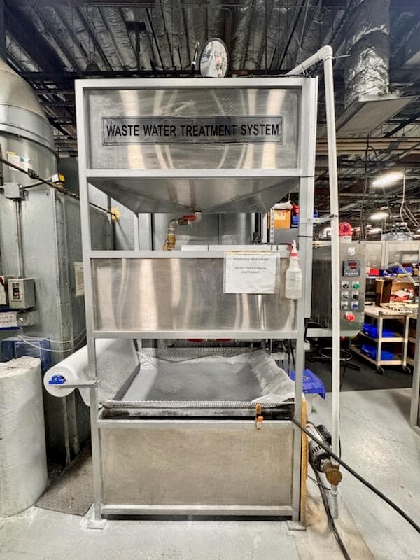 WW 200 installed on a shop floor with filter media in the sludge tray