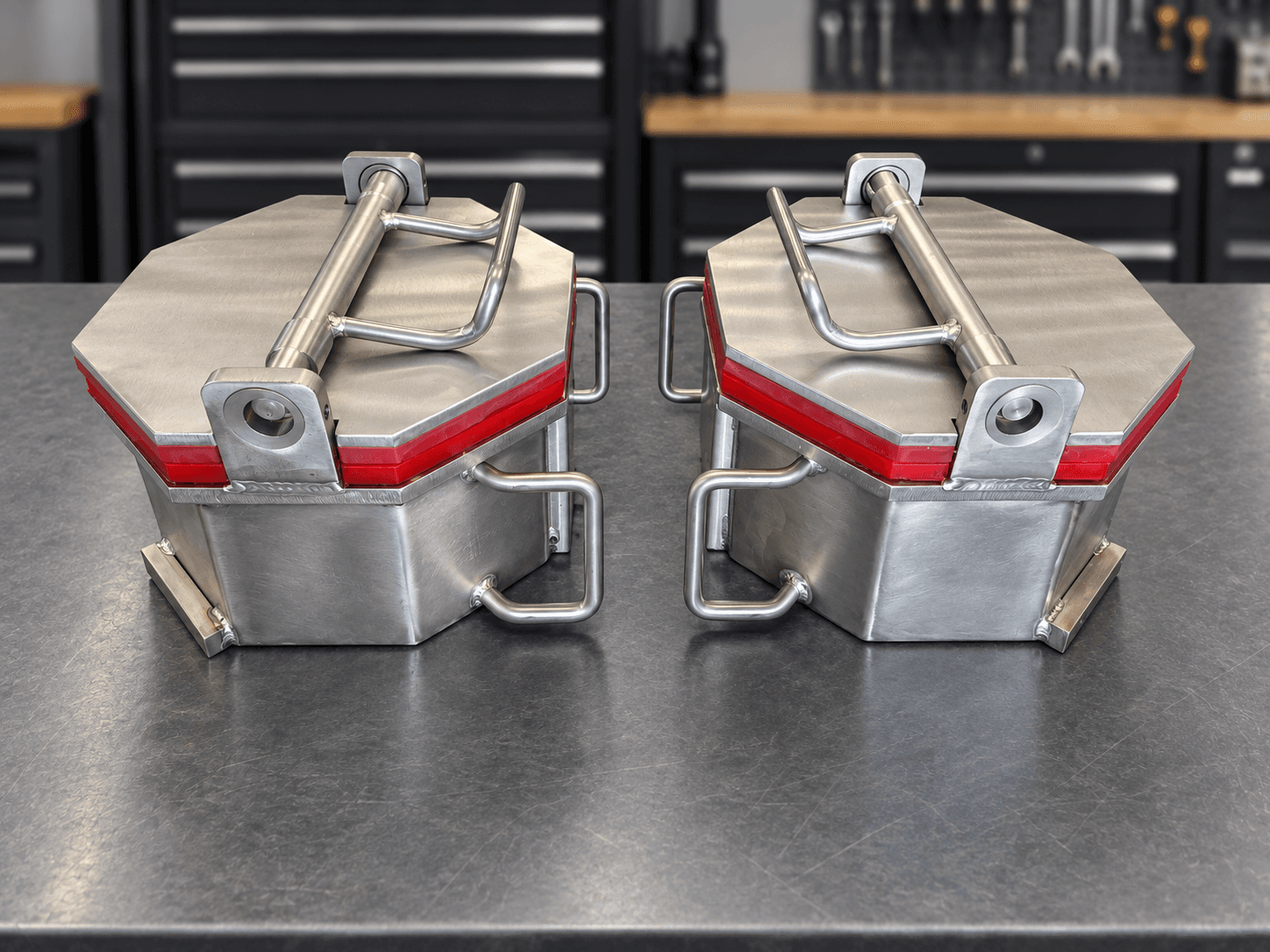 Two CV8-600 one-eighth cubic foot barrels with red polyurethane liners and eccentric collar lid closures on a workbench