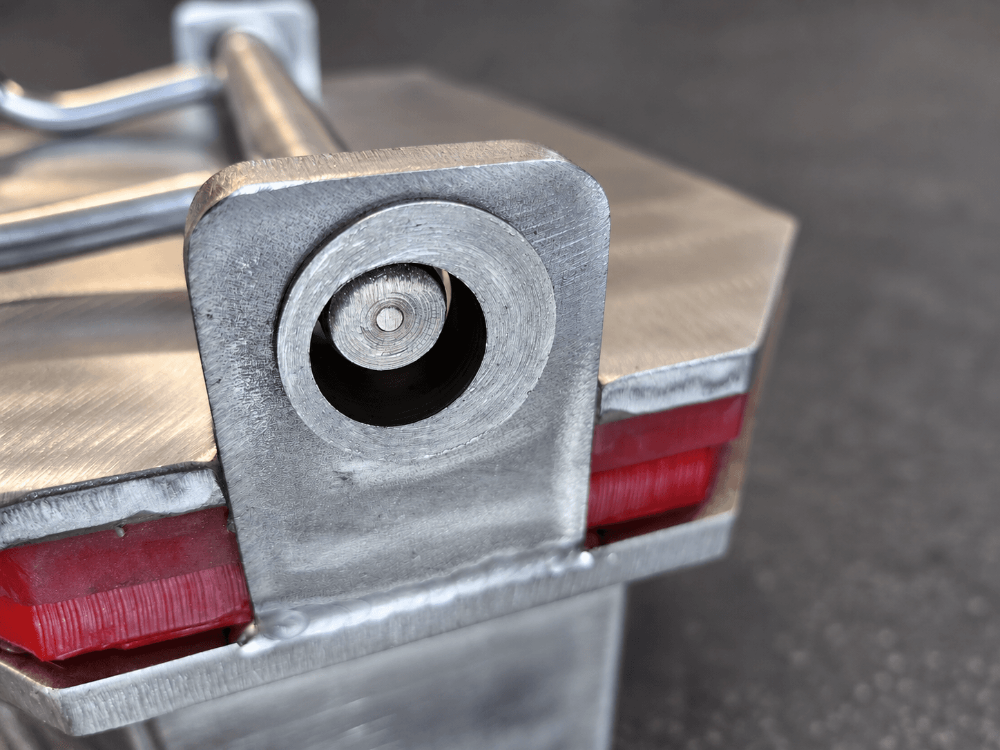 Close-up of the CV8-600 replaceable eccentric collar and offset shaft above the red polyurethane lid seal