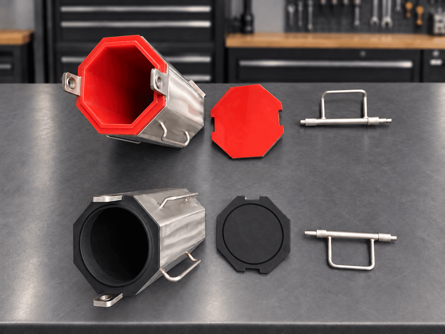 CV8-600 quarter-cubic-foot barrels with red replaceable polyurethane lining and black rubber lining, with lids and locking handles on a professional workbench